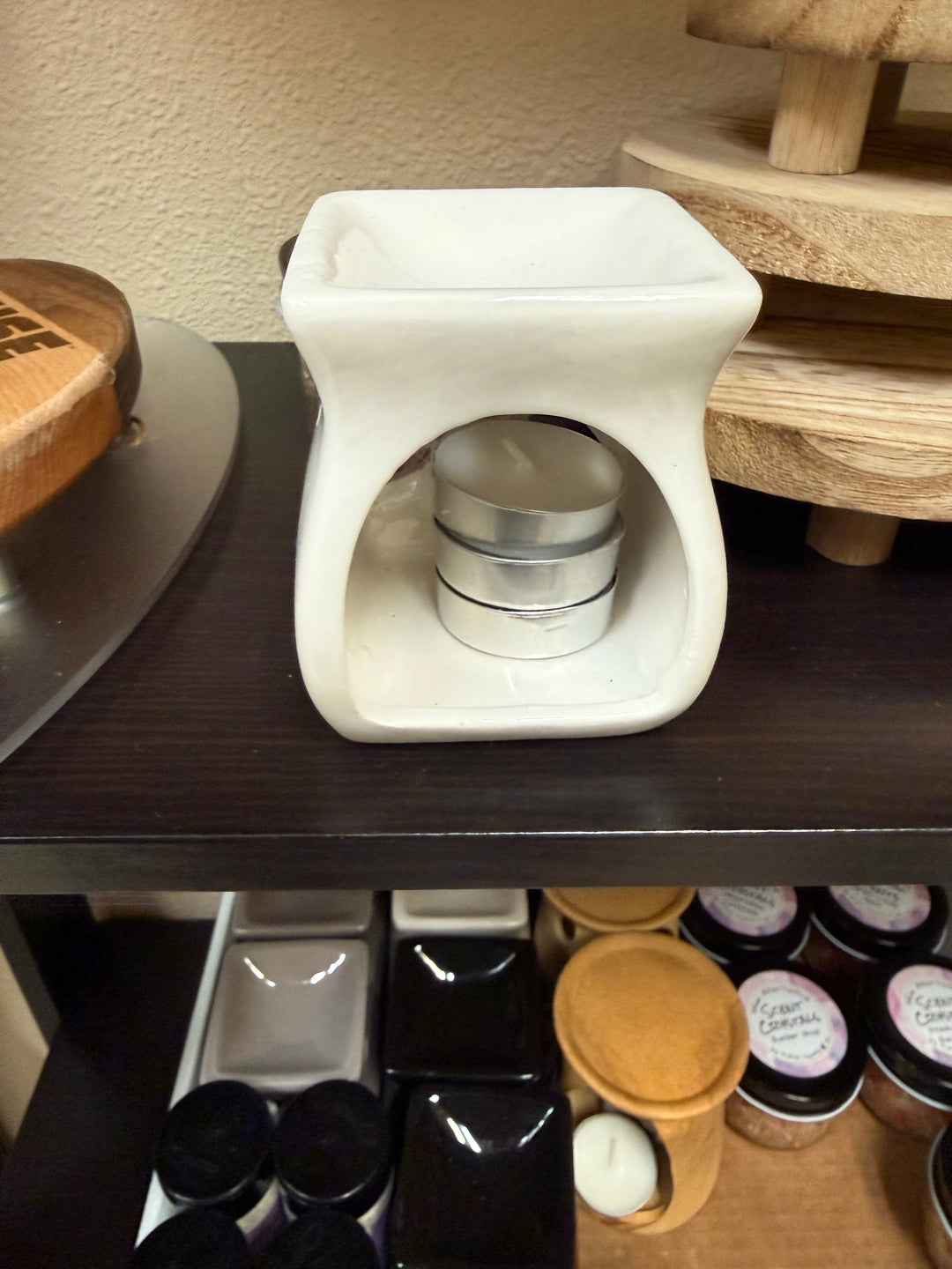 Salt and wax warmer in glossy white ceramic with tealights in the base