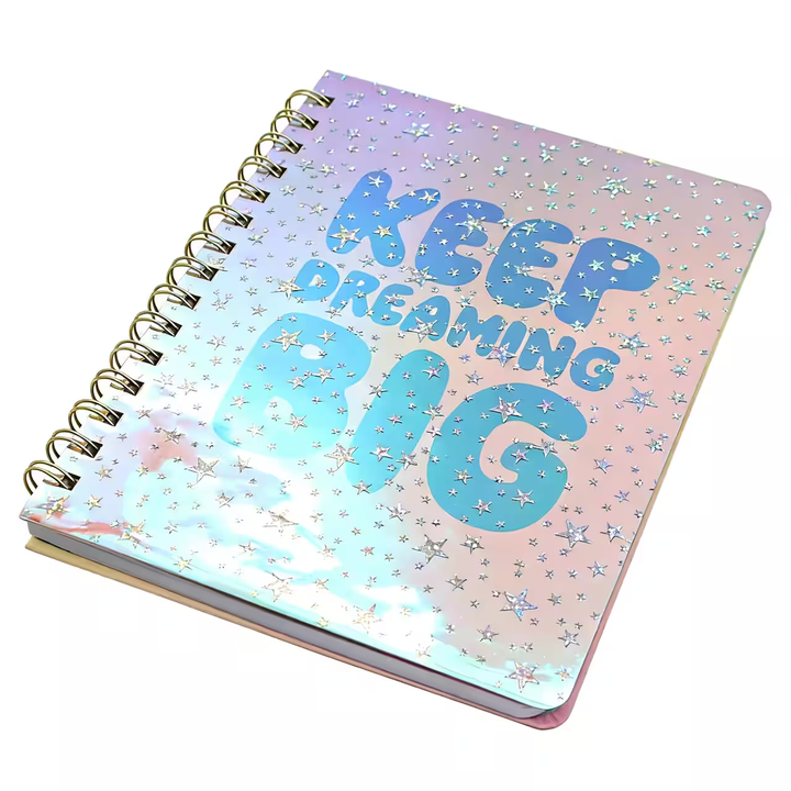 Keep Dreaming Big notebook opened flat showing pink lined pages