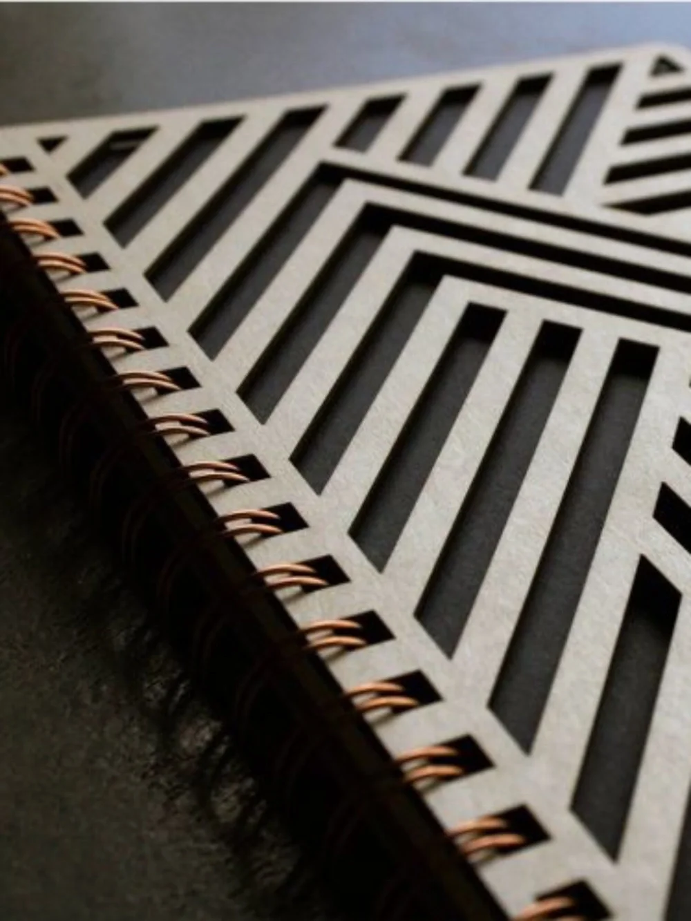 Denik wooden notebook opened, showing the inside cover and Please Return To page