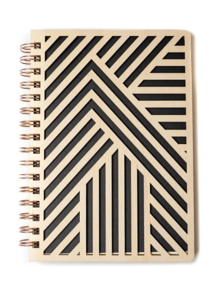 Denik spiral bound notebook with a laser cut birch wood cover in a black and natural chevron pattern and copper wire binding