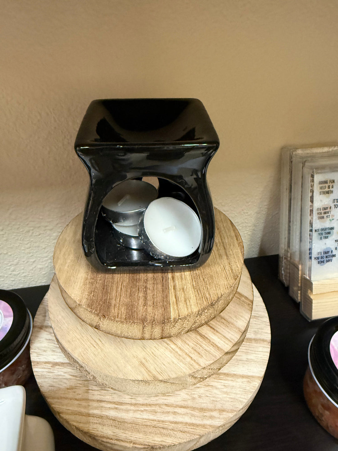 Salt and wax warmer in natural wood tone with tealights in the base